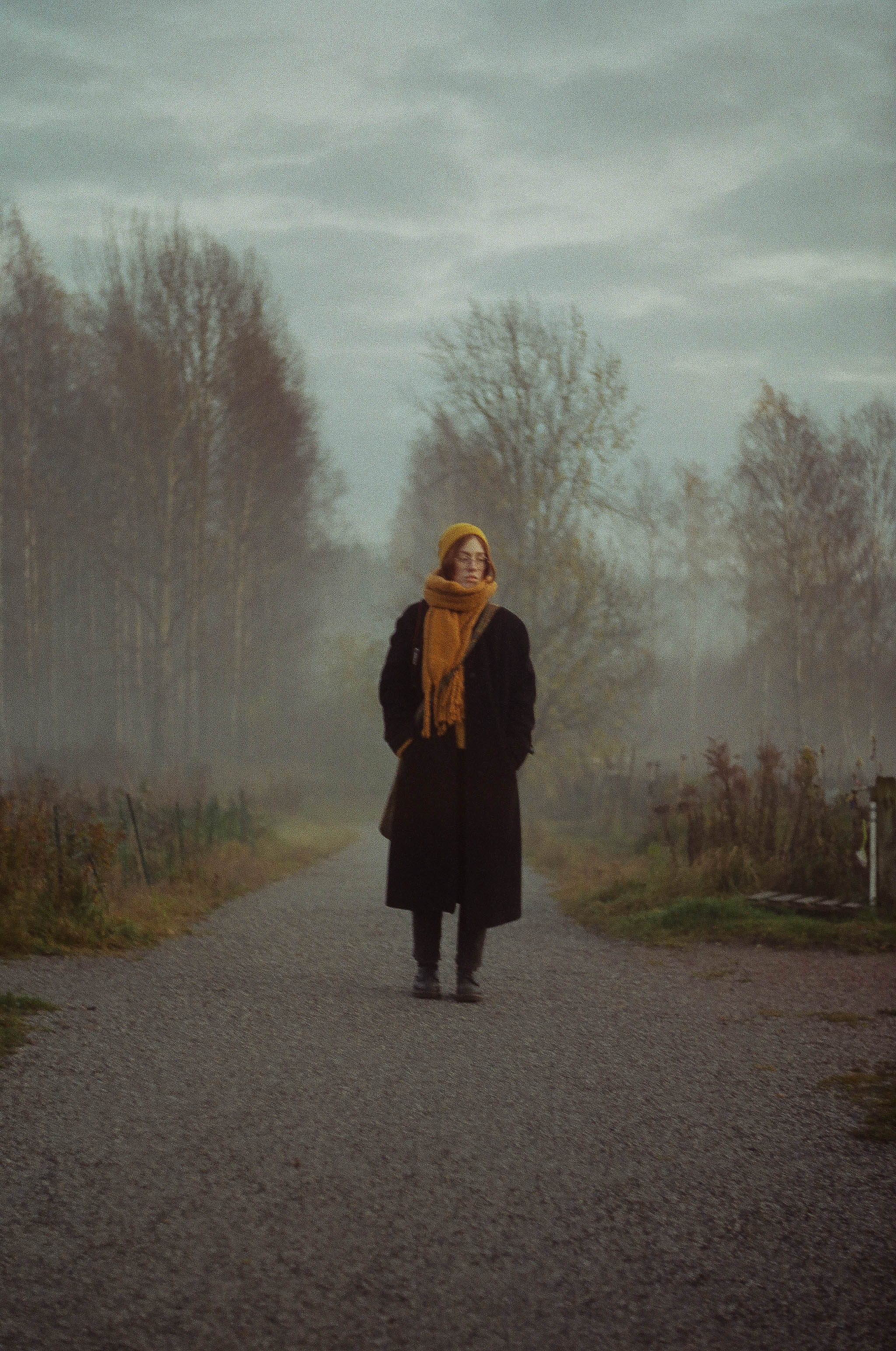 Woman foggy road